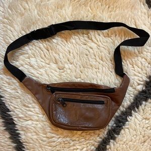 Brown leather waist pack.